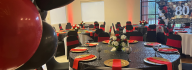 80th birthday celebration with red and black decor