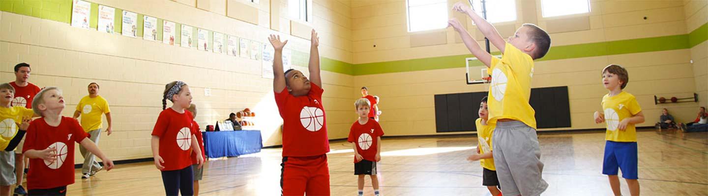 Young boys playing basketball in the Y's gymnasium