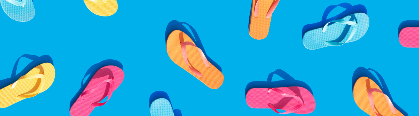 Blue background with pink, yellow, orange and blue flip flops