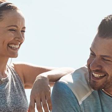 Man and woman smiling after going for a run