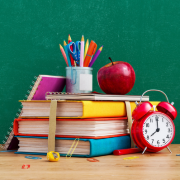 Ready for school concept background with books, alarm clock and accessory
