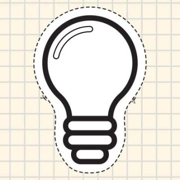 Dotted line light bulb graphic cut out on graph paper.