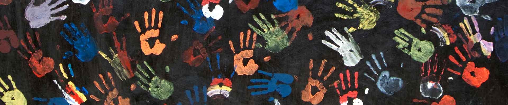 Painted handprints against black background