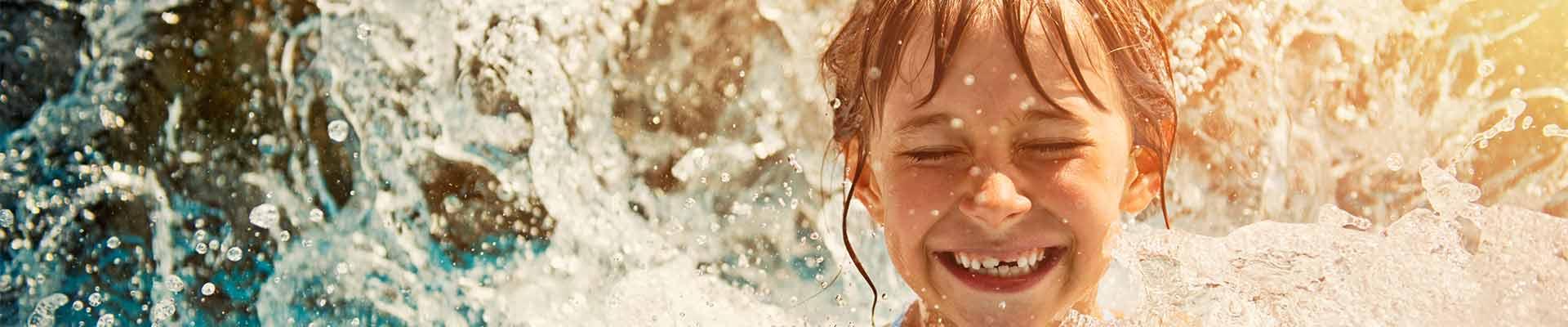 child smiling in water